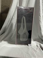 Front view of sealed Formedica bathtub safety rail box