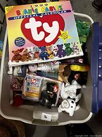 Tote with calendar on top and visible Beanie Babies inside