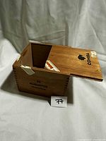 Box closed showing lid logo and capacity marking