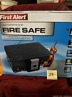 Front of retail box showing First Alert waterproof fire safe and product image
