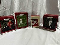 Front view of four Hallmark Keepsake ornament boxes