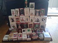 Full lot of boxed Wizard of Oz ornaments stacked
