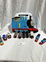 Front view of Thomas-shaped carry case with ten trains displayed