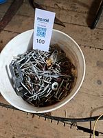 Bucket with mixed fasteners and MaxSold card visible