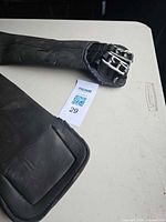 Full view of girth end showing stainless steel roller buckles and neoprene body