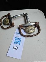 Full view of snaffle bit showing D-rings, mouthpiece and medallion