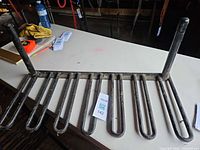 Overall view of boot rack showing eight slots and vertical posts