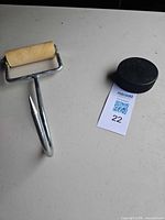 Full view of hay hook beside reference object