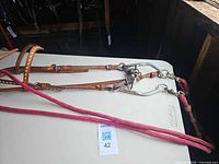 Entire bridle laid out showing headstall, bit, reins and curb chain
