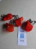 Four red padlocks grouped with keys visible