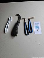 All four hoof picks and knife laid out