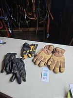 Overview of three glove pairs on table