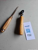 Seam roller and screwdriver/chisel side by side