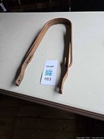 Gate opener flat on table showing overall U-shaped frame