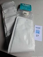 Entire girth sleeve folded with retail tag and packaging visible