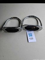 Pair of stirrups top/angled view on table