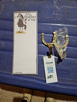 Notepad and brass horseshoe hook overview