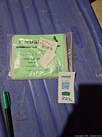 Packaged Partrade saddle cover with insert card and lot tag visible