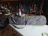Full view of Zareba branded black carry bag on table