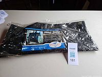 Front of packaged hay tote with product label visible