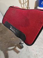 Full view of red saddle pad on stand