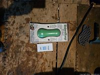 Front view of packaged RidersRasp Trail showing green handle