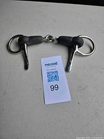 Entire bit laid flat showing both shanks and mouthpiece