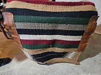 Front view showing full striped pattern and leather side panels