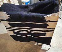 Front view of woven saddle pad showing full geometric pattern and colors