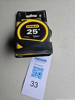 Front of tape measure in packaging showing Stanley 25' Tylon label