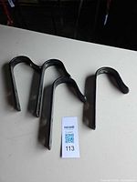 All four Stubbs black metal hooks on tabletop