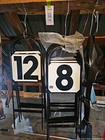 Overall view showing paddles stacked together, numbers 12 and 8 visible
