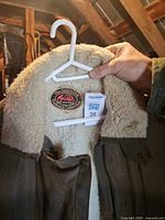 Interior collar showing brand patch and size tag