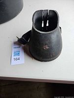 Front view of VAL-A rubber bell boot showing logo and overall shape