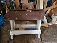 front view of wooden support stand showing brown top and white legs