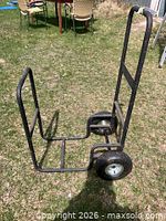 Full view of steel log dolly on lawn