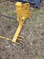 Side view of CountyLine yellow adapter frame on ground