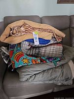 Stacked assortment showing all six bedding pieces on couch