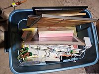 Top view of tub showing picture frames, rack, decorative boxes and ornament