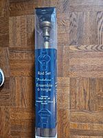 Full view of packaged Berkshire curtain rod set