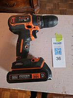 Black & Decker 20V cordless drill/driver showing battery, model label, overall condition