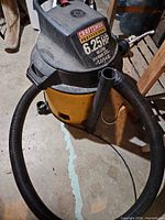 Craftsman Professional wet/dry vacuum with hose coiled around base