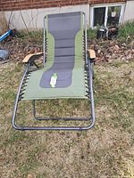 Full view of green and gray zero gravity lounge chair on lawn