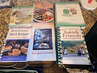 Group shot of all six cookbooks showing covers and bindings