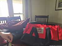 Overview of Handy Toughest tool bag with additional bags on table