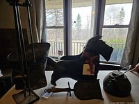Group shot showing kettle, dog planter, bucket, fireplace tool stand, shovel and brush