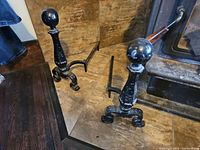 Both andirons showing overall design and finish