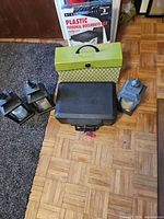 Group view of three lanterns, cash box, file box