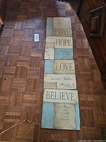 Four plaques laid vertically showing overall design and colors