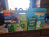 Group shot showing all sealed Swiffer and Vileda boxes